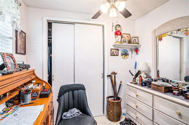 bedroom with a ceiling fan and a closet