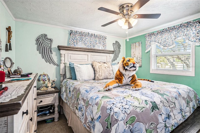 bedroom featuring a textured ceiling, ornamental molding, and ceiling fan