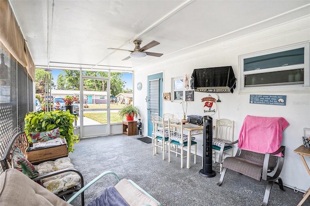 sunroom featuring ceiling fan