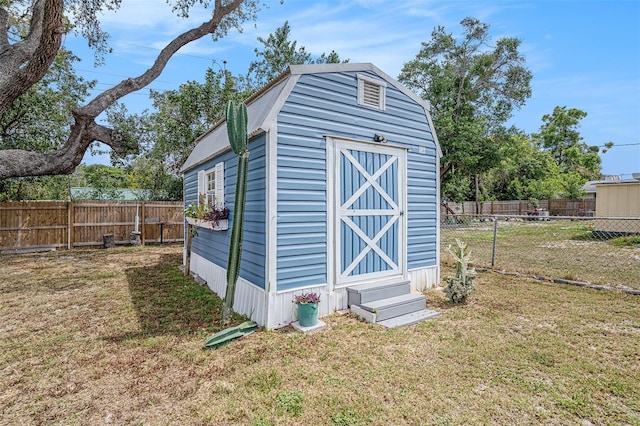 view of shed with a fenced backyard