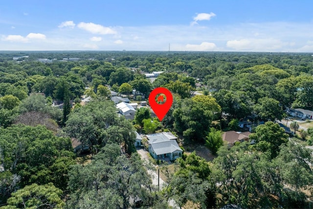 birds eye view of property with a wooded view