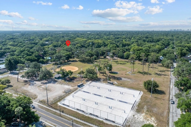 aerial view featuring a wooded view