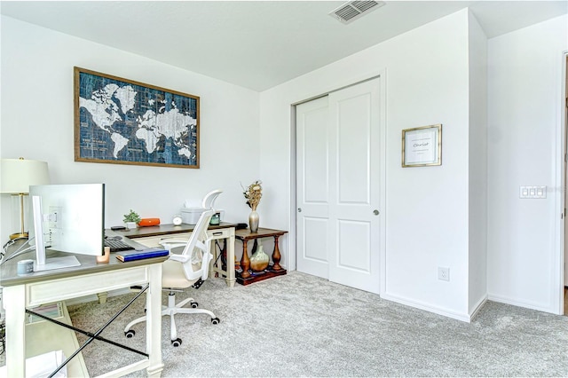 office with visible vents, carpet, and baseboards