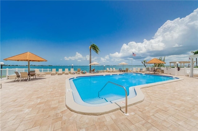 pool with fence and a patio area