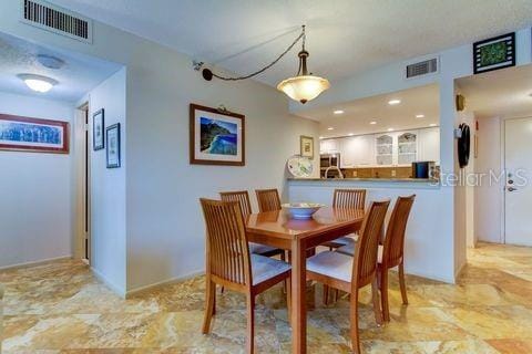 dining room with visible vents