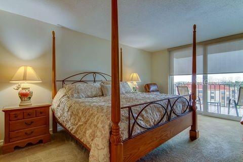 bedroom with access to outside and carpet
