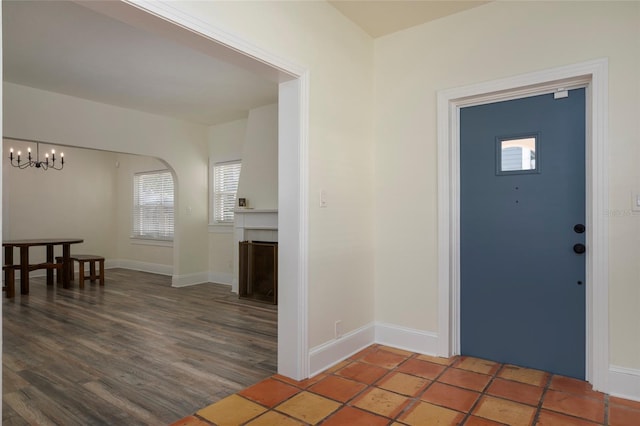 1606 S Arrawana Ave, Tampa, FL 33629 - foyer entrance with baseboards, an inviting chandelier, and a healthy amount of sunlight