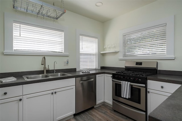 1606 S Arrawana Ave, Tampa, FL 33629 - kitchen with a sink, appliances with stainless steel finishes, and dark countertops
