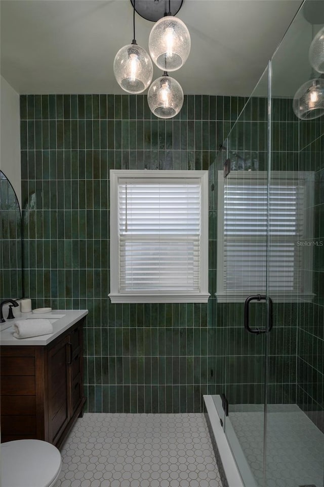 1606 S Arrawana Ave, Tampa, FL 33629 - bathroom featuring tile walls, a shower stall, and vanity