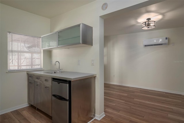1606 S Arrawana Ave, Tampa, FL 33629 - kitchen with a sink, fridge, wood finished floors, and an AC wall unit
