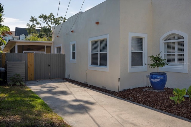 1606 S Arrawana Ave, Tampa, FL 33629 - view of property exterior with fence, a gate, and stucco siding