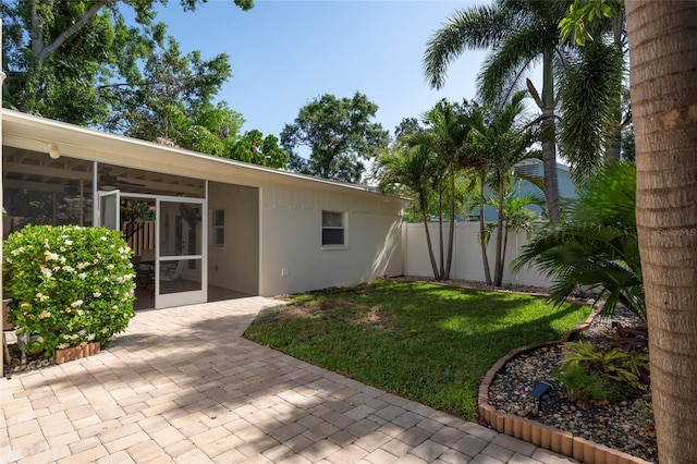 1606 S Arrawana Ave, Tampa, FL 33629 - view of yard featuring a sunroom, fence, and a patio