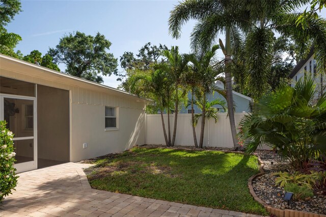 1606 S Arrawana Ave, Tampa, FL 33629 - view of yard featuring fence, a sunroom, and a patio area