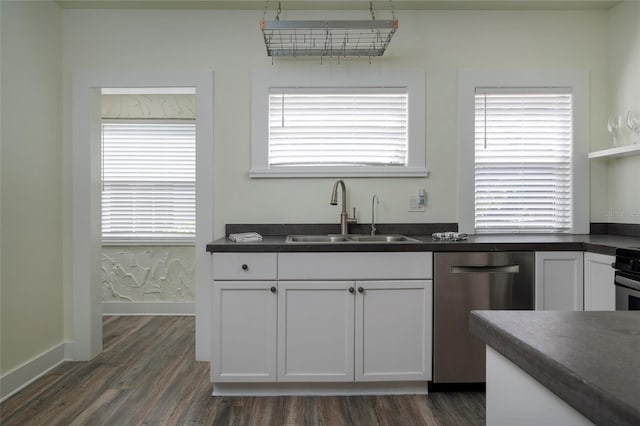 1606 S Arrawana Ave, Tampa, FL 33629 - kitchen featuring stainless steel dishwasher, a sink, dark wood-type flooring, and dark countertops