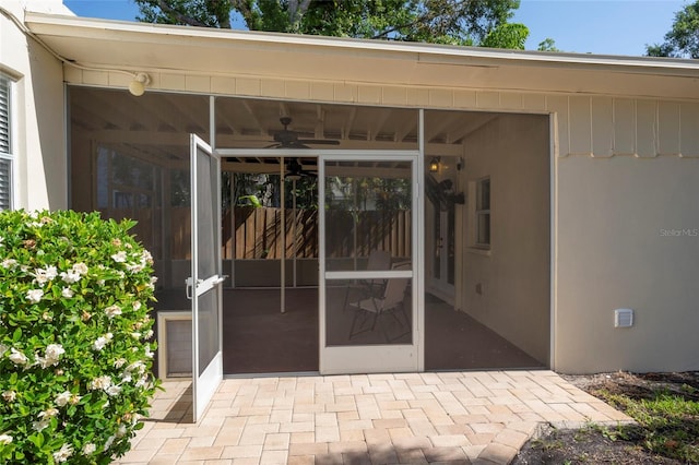 1606 S Arrawana Ave, Tampa, FL 33629 - entrance to property featuring ceiling fan, a patio area, and stucco siding