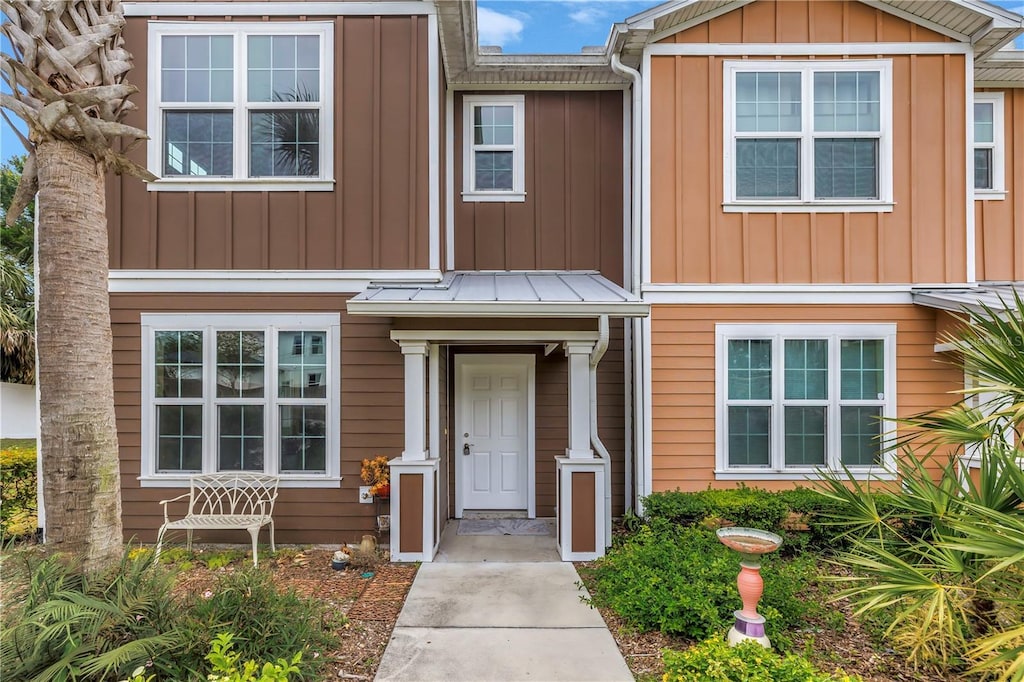 1116 Martin Luther King Jr Ave, Dunedin, FL 34698 - view of property with board and batten siding