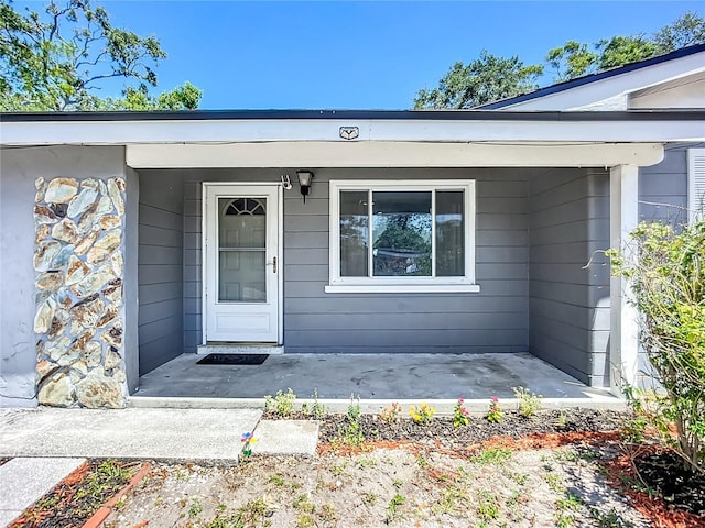 10931 110th Ave, Seminole, FL 33778 - view of exterior entry with a porch