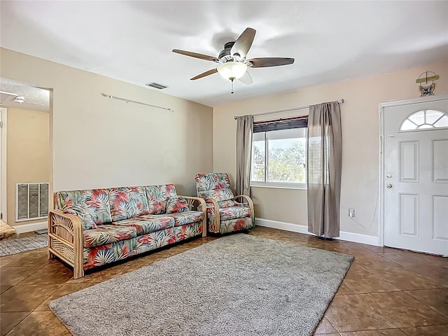 10931 110th Ave, Seminole, FL 33778 - tiled living room featuring ceiling fan and baseboards