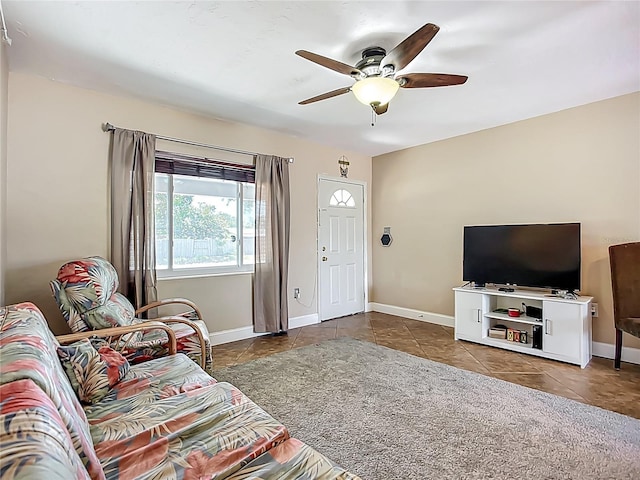 10931 110th Ave, Seminole, FL 33778 - living area featuring ceiling fan, tile patterned flooring, and baseboards