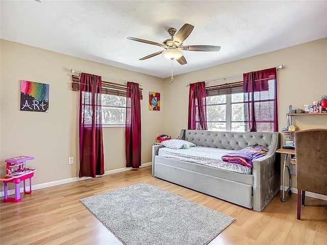 10931 110th Ave, Seminole, FL 33778 - bedroom with baseboards, wood finished floors, and ceiling fan
