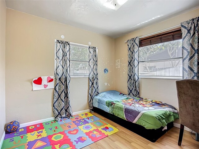 10931 110th Ave, Seminole, FL 33778 - bedroom with wood finished floors and baseboards