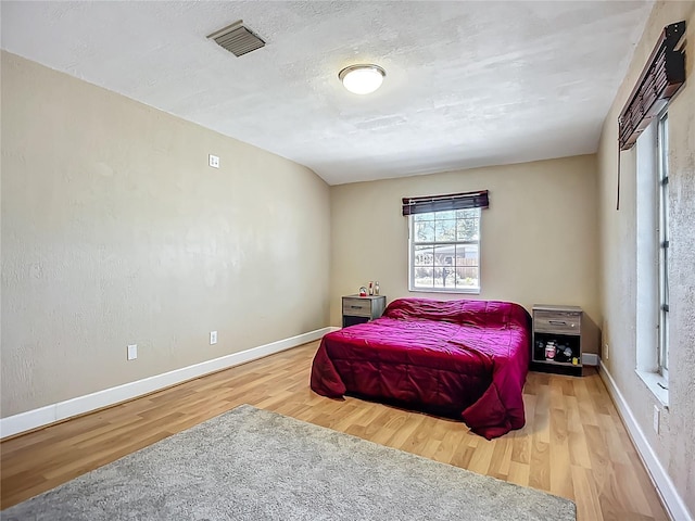 10931 110th Ave, Seminole, FL 33778 - bedroom featuring wood finished floors and baseboards