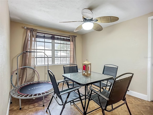 10931 110th Ave, Seminole, FL 33778 - tiled dining space with ceiling fan, baseboards, and a desk