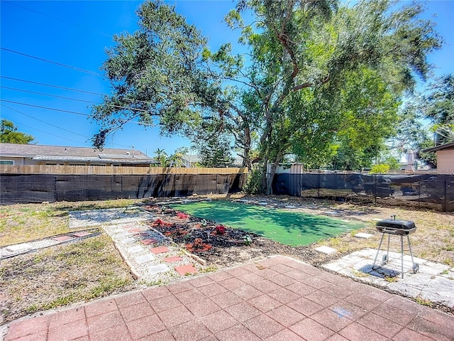 10931 110th Ave, Seminole, FL 33778 - fenced backyard featuring a patio