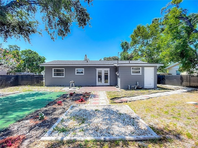 10931 110th Ave, Seminole, FL 33778 - back of house featuring french doors