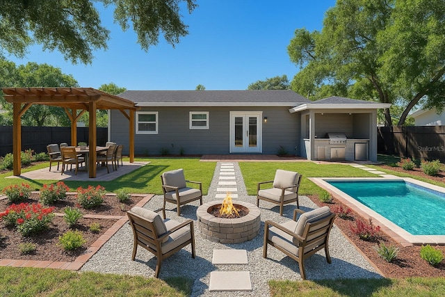 10931 110th Ave, Seminole, FL 33778 - back of house with an outdoor fire pit, exterior kitchen, french doors, a patio area, and a pergola