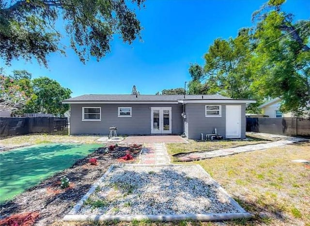 10931 110th Ave, Seminole, FL 33778 - rear view of house with french doors