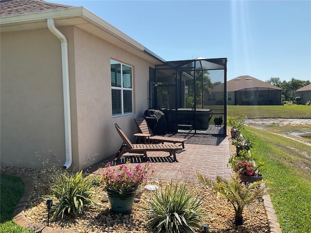 view of patio / terrace with glass enclosure