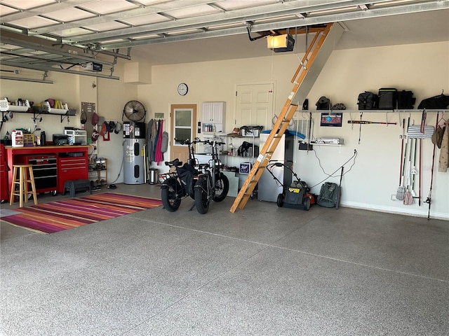 garage with hybrid water heater, a workshop area, and a garage door opener