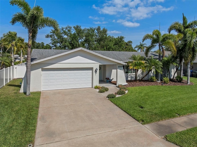 1849 Del Robles Dr, Clearwater, FL 33764 - single story home with fence, driveway, a front yard, and a garage