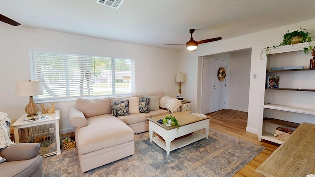 1849 Del Robles Dr, Clearwater, FL 33764 - living room with visible vents, baseboards, ceiling fan, and wood finished floors