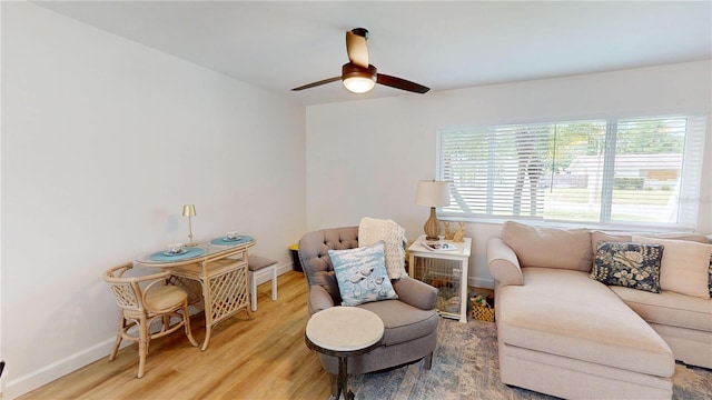 1849 Del Robles Dr, Clearwater, FL 33764 - living room featuring baseboards, ceiling fan, and light wood-style floors