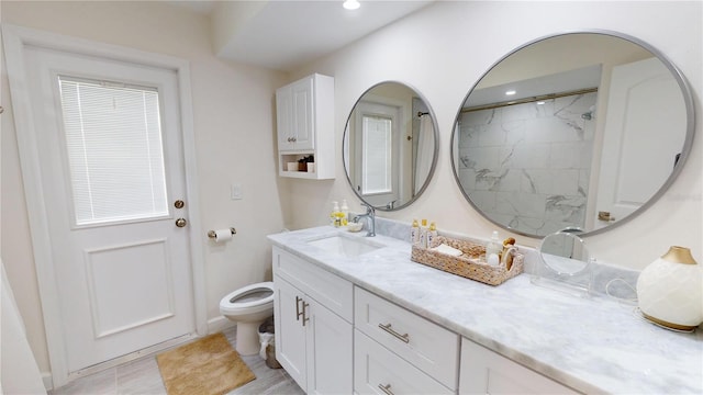 1849 Del Robles Dr, Clearwater, FL 33764 - bathroom with recessed lighting, vanity, walk in shower, and toilet