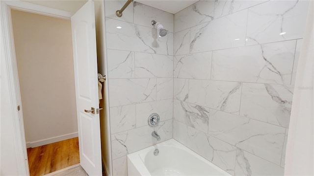1849 Del Robles Dr, Clearwater, FL 33764 - full bath with shower / bath combination, baseboards, and wood finished floors
