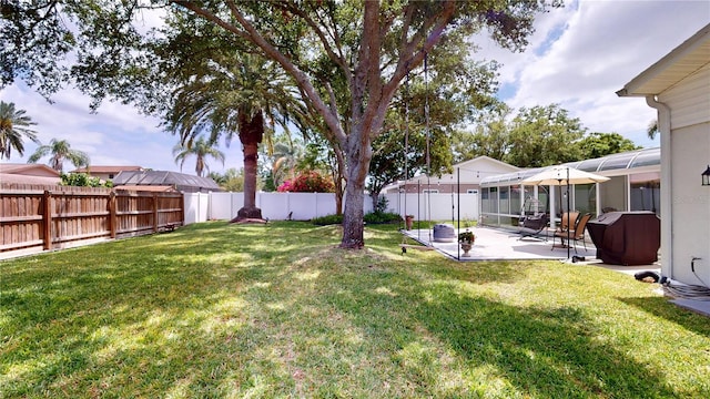 1849 Del Robles Dr, Clearwater, FL 33764 - view of yard featuring a fenced backyard, a sunroom, and a patio area