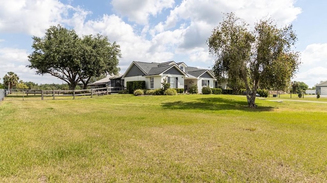 view of front of property with fence and a front yard