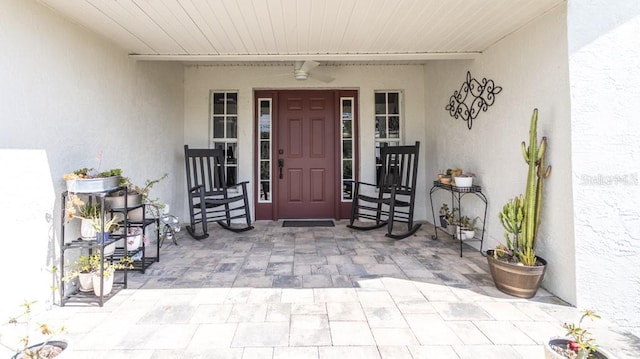 view of exterior entry featuring stucco siding