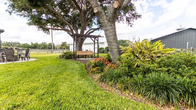 view of yard with a patio and fence