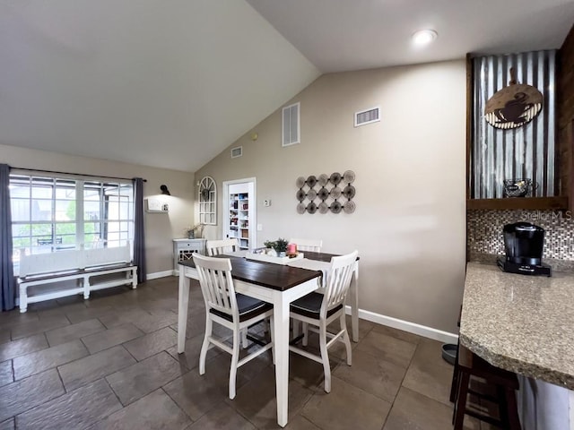 dining space with baseboards and visible vents