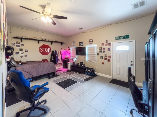 tiled bedroom with visible vents and ceiling fan