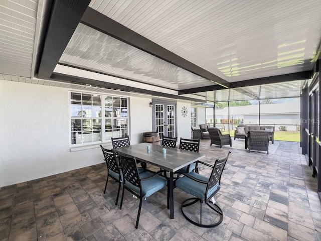 sunroom with plenty of natural light and french doors