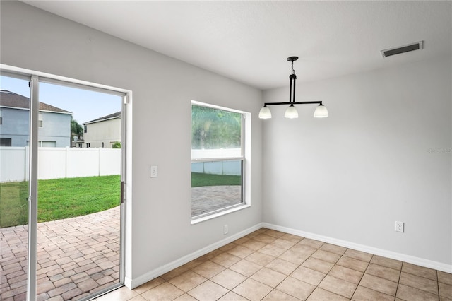 1506 Lenton Rose Ct, Trinity, FL 34655 - unfurnished dining area featuring light tile patterned flooring, baseboards, visible vents, and a healthy amount of sunlight