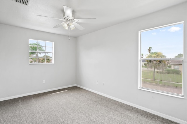 1506 Lenton Rose Ct, Trinity, FL 34655 - empty room with carpet floors, baseboards, a ceiling fan, and visible vents