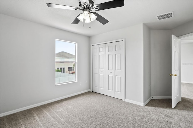 1506 Lenton Rose Ct, Trinity, FL 34655 - unfurnished bedroom with baseboards, a ceiling fan, carpet flooring, and visible vents