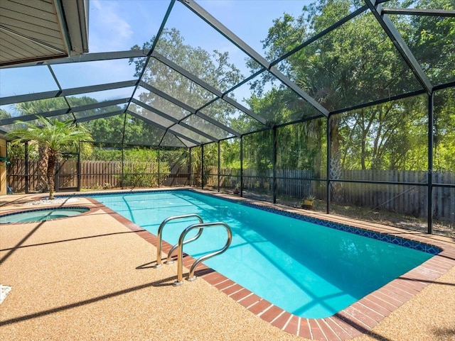 view of pool featuring an in ground hot tub, a fenced in pool, and a fenced backyard