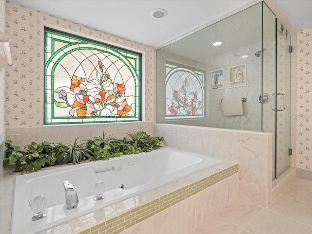 bathroom with tile patterned floors, a stall shower, wallpapered walls, and a bath